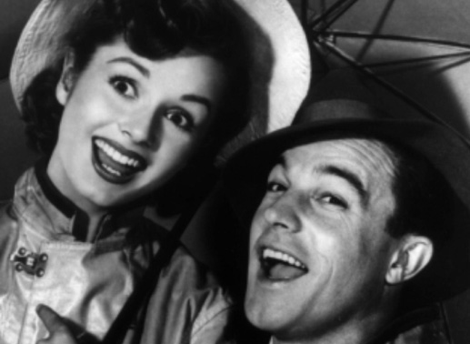 Mit Schirm und Charme auf dem Weg ins Glück: Die kleine Tänzerin Kathy Seiden (Debbie Reynolds) und der kommende Musical-Star Don Lockwood (Gene Kelly).
